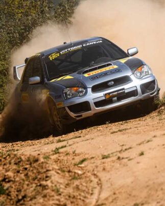 Rally car drifting on dirt road